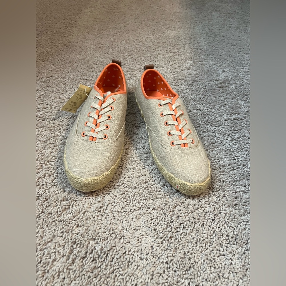 Tan canvas with orange trim.